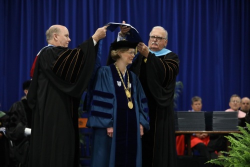 Photo of Dr. Lorraine de Montluzin’s hooding during FMU’s commencement exercises on May 4, 2024